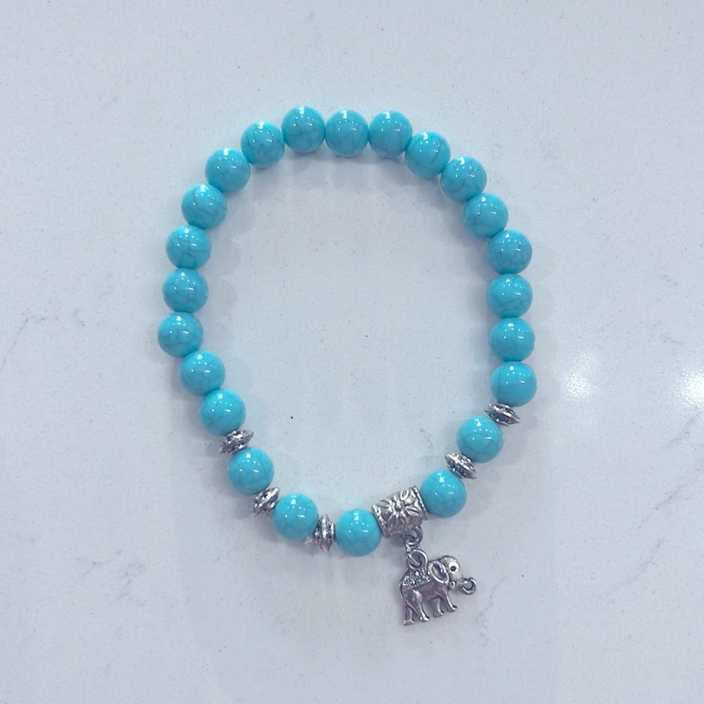 Turquoise stone bracelet with elephant charm